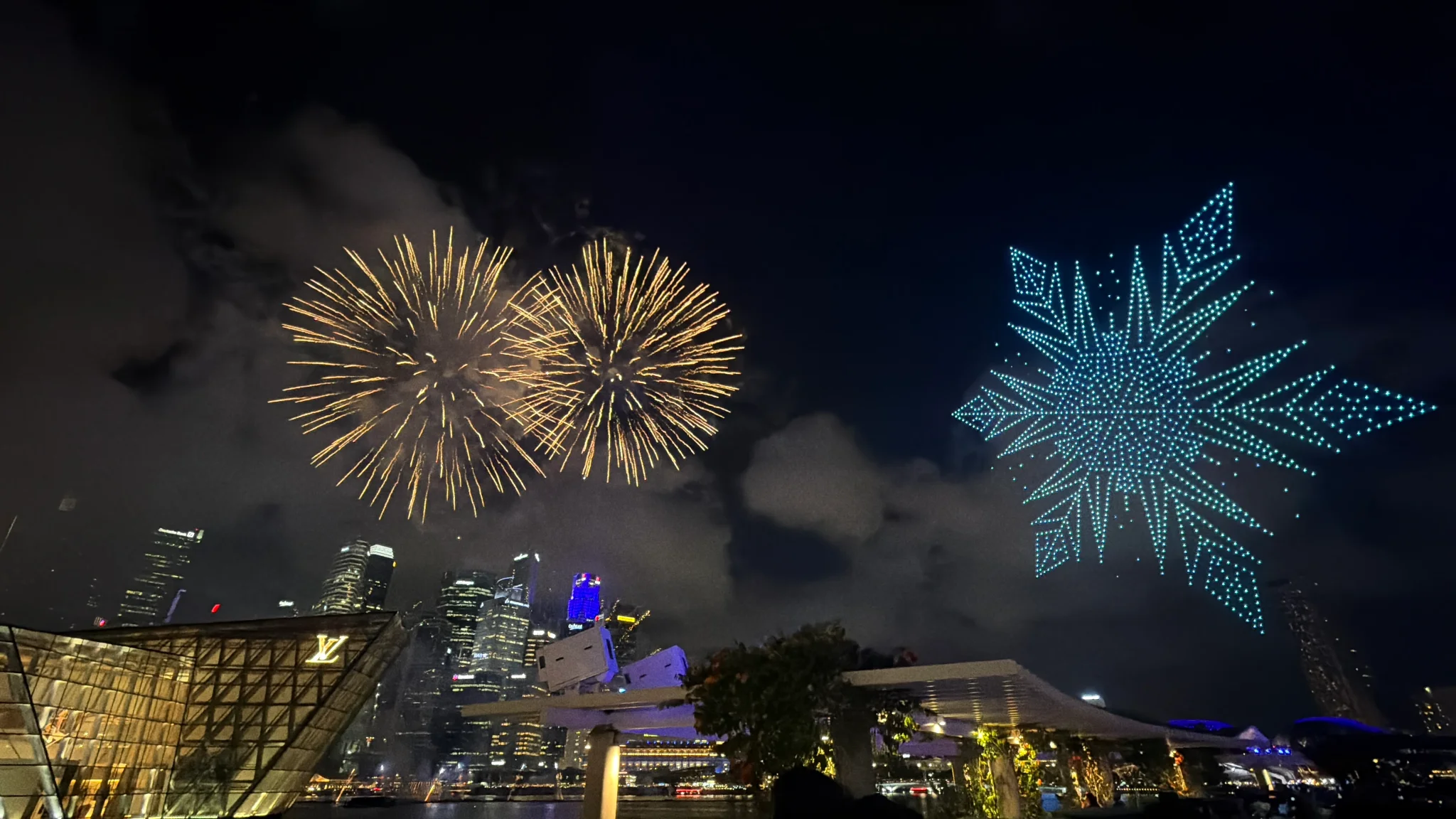 Disney drone and fireworks show Elsa lighting up Marina Bay Singapore skyline at night